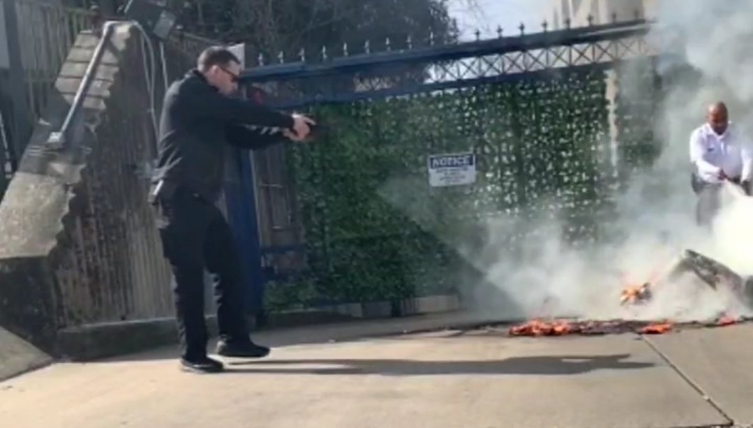 Of course an Israeli guard points a gun at a dying man whose on fire rather than grabbing a fire extinguisher.