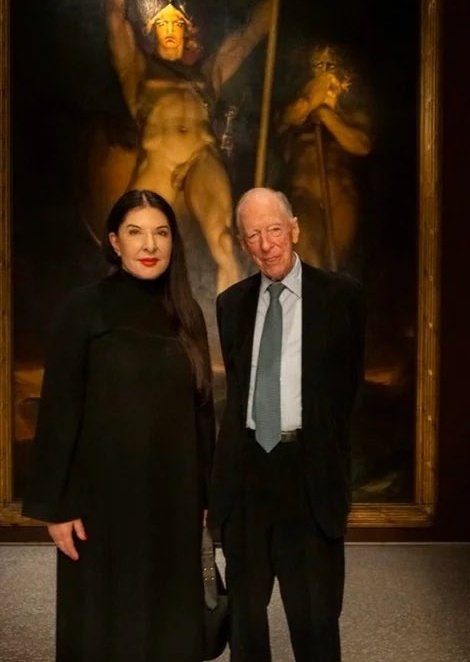 Jacob Rothschild standing in front of Sir Thomas Lawrence's painting: 'Satan Summoning His Legions,' next to Marina Abramovic, famous for her Satanic art, who was appointed by Zelensky as Ukraine's Ambassador for Children. Jeffrey Epstein wasn't available for the photo shoot.