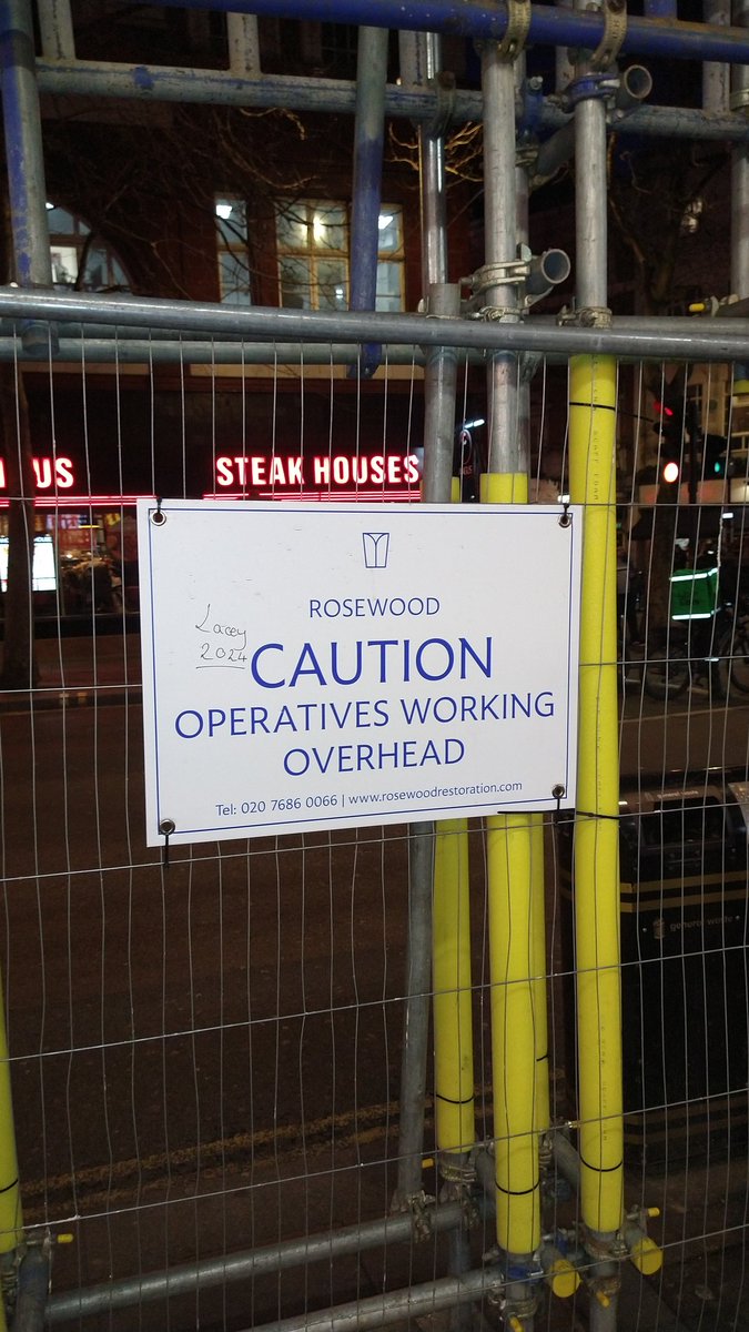 Intrigued by this sign in Leicester Square, London. As a pedestrian walking underneath this scaffolding what extra caution is it suggesting I take? Put my hands over my head in case something falls? Maybe run to minimise my time underneath?