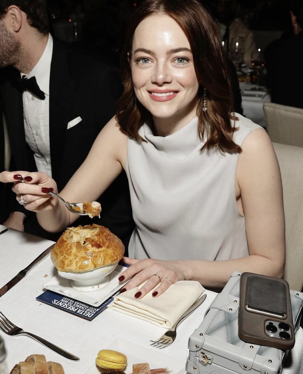 Why would a photographer snap a picture of Emma Stone mid-chicken pie