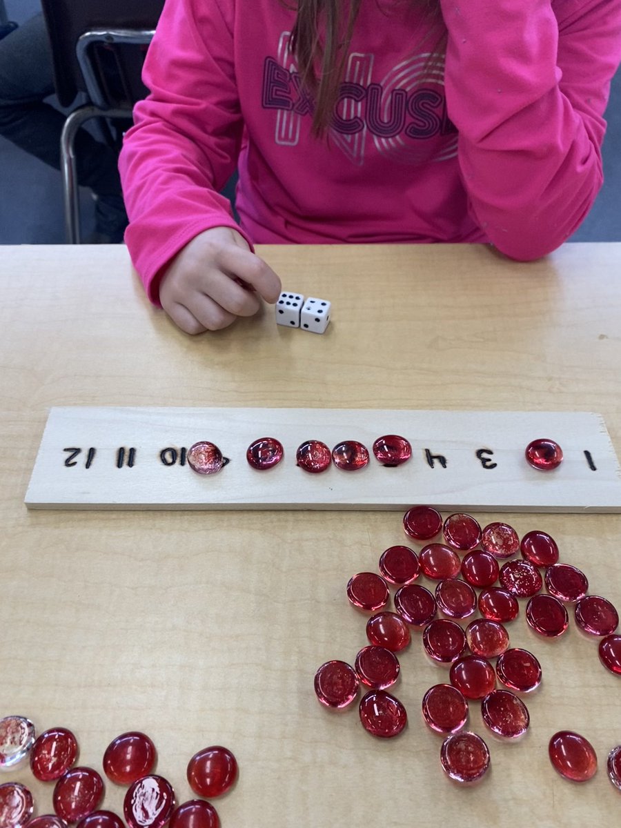 MsDunlopTeaches's tweet photo. Math magic in action 💫 students roll two dice, add them up, then cover that number with a gem on the number line. This student even shared 3 ways to make the number 10 with two dice - rolling a 3 &amp; 7, a 4 &amp; 6, and a 5 &amp; 5! 🤩 #RollCountCover @EY_uwindsor @Miss_Fraser3 @WECDSB https://t.co/SA80BDG5xG