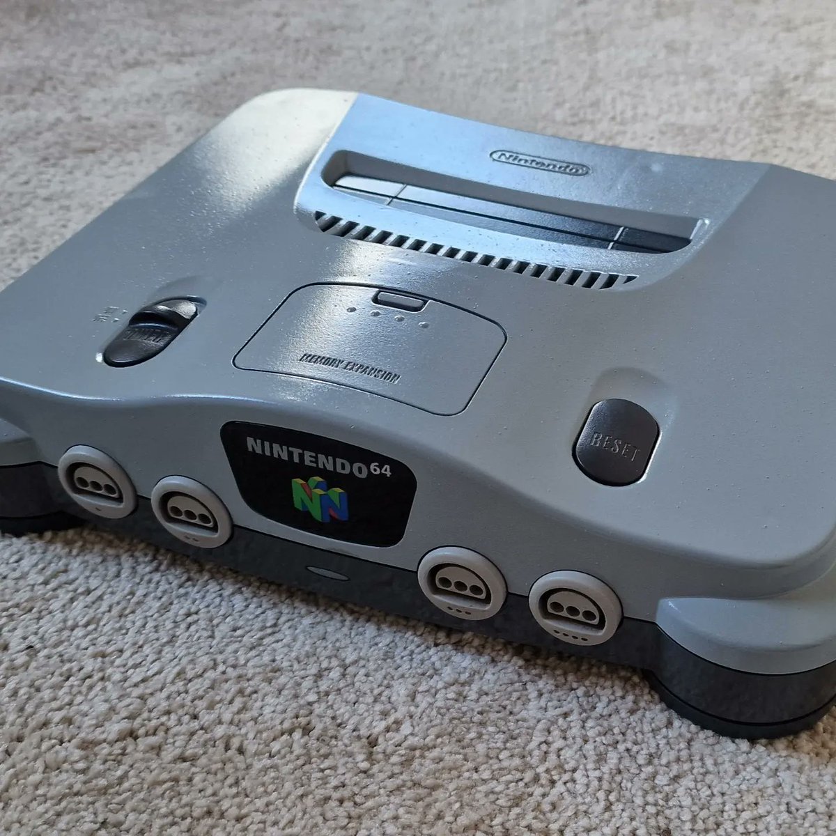 Gamedesigndiary's tweet photo. Just gave my beaten up N64 a fresh coat of paint :) #Nintendo #n64 #Retro #retrogames https://t.co/z8QJWx0BGT