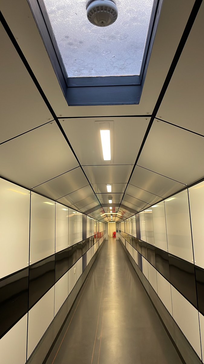 This road is like the path you take to board a plane at the airport, but it is actually a cool underground tunnel that connects the Radcliffe Camera and the Bodleian Library. It's like a tunnel between the old and the new!