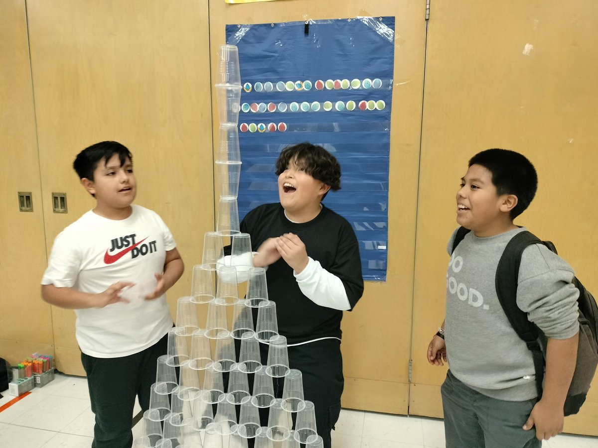 YouthServiceSLC's tweet photo. Students, staff, and families at Western Hills Afterschool Program participated in a We Love STEM Family Night. Students engineered 100 cup towers, made diffusion art bags with Chemistry principles, and played with robot chameleons. https://t.co/5zTrbXP4yj