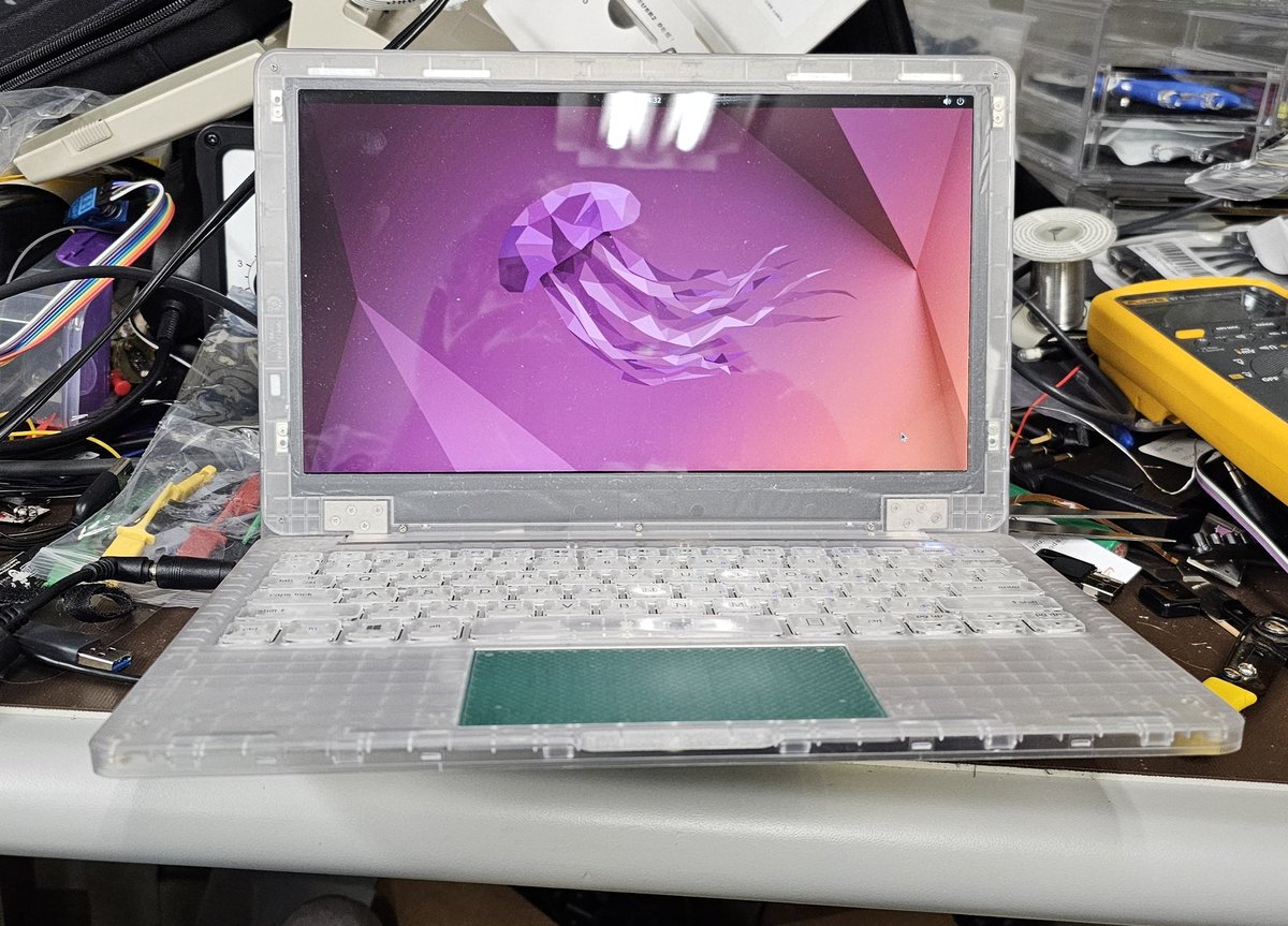 ajfabio's tweet photo. Ubuntu live booting from the fingerprint reader usb port. Had to solder to an unpopulated cap near the sata port to get 5v. Data lines are from the flex. https://t.co/u4TJpGsb92