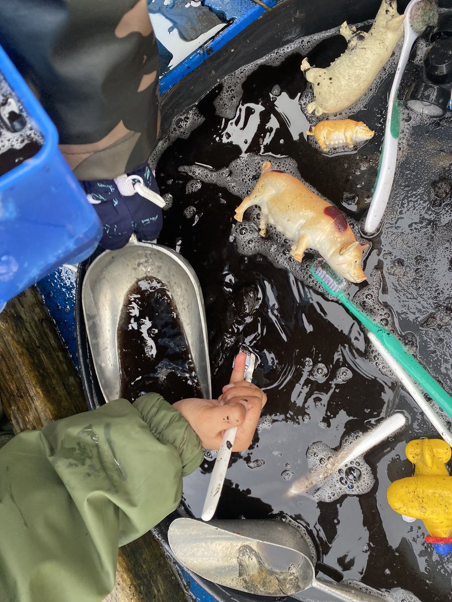 Keeping little hands busy outside today in Nursery with playdoh platters and muddy pig scrubbing! #EYFSOutdoors #invitationtoplay