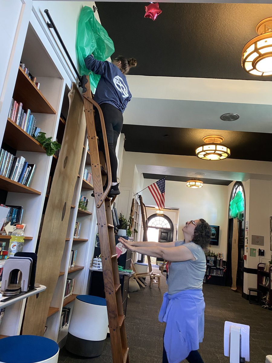 BTS for Book Week in the Roll Library. It takes a village! (Especially when one is afraid of heights.) #library #librarians #bookweek