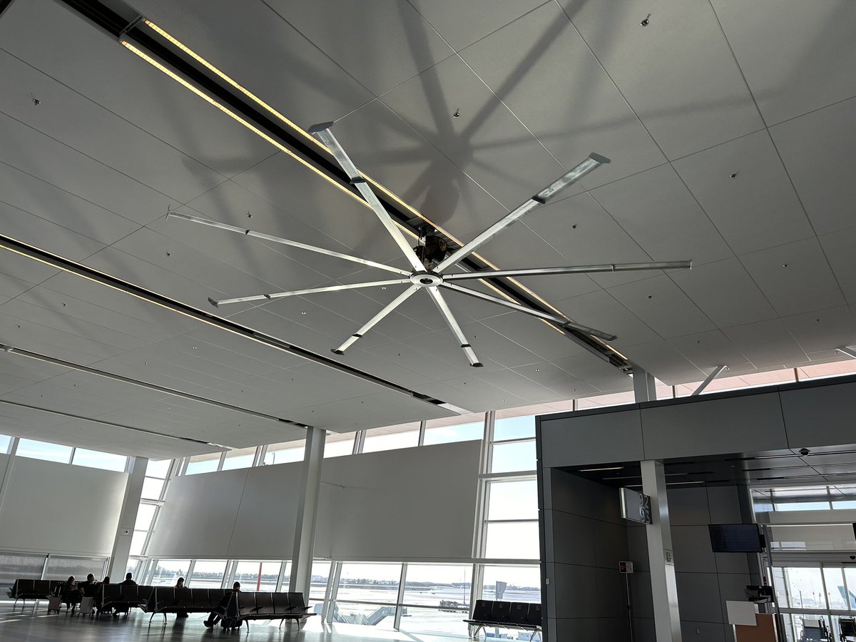 Anyone have a big ceiling fan like this in their shop?  Any downsides to them?  Issues with light flicker due to lights above them?