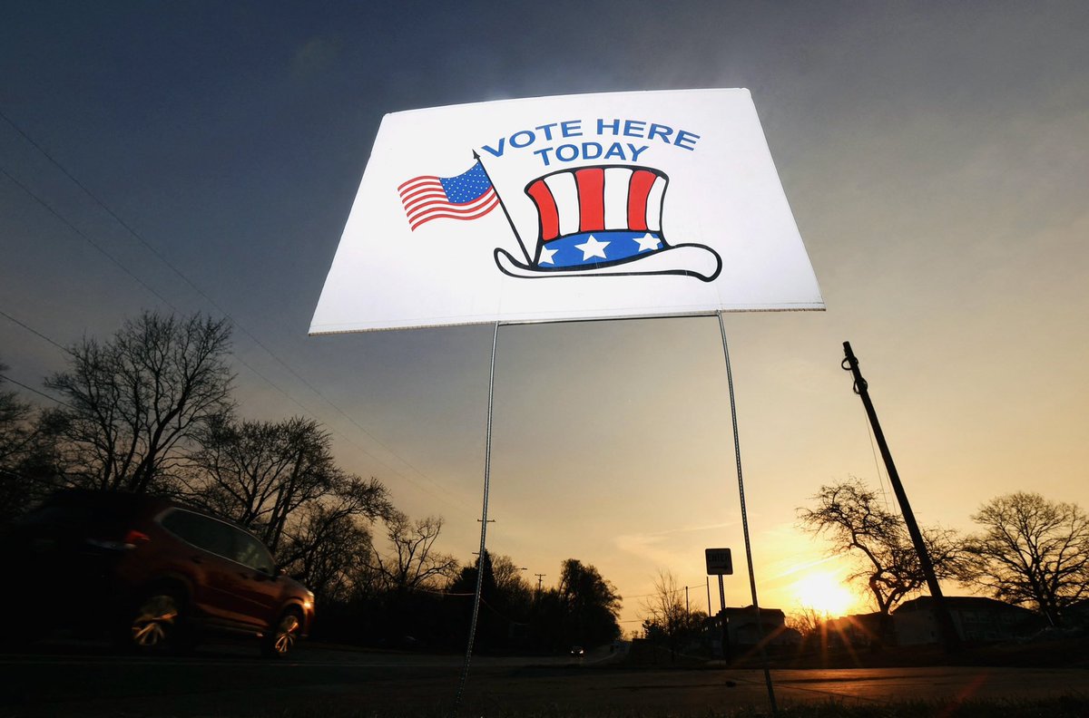 A sing displays information about voting, as Democrats and Republicans hold their Michigan primary presidential election, in Grand Rapids, Michigan, U.S. February 27, 2024. Photo for @Reuters #MichiganPrimary