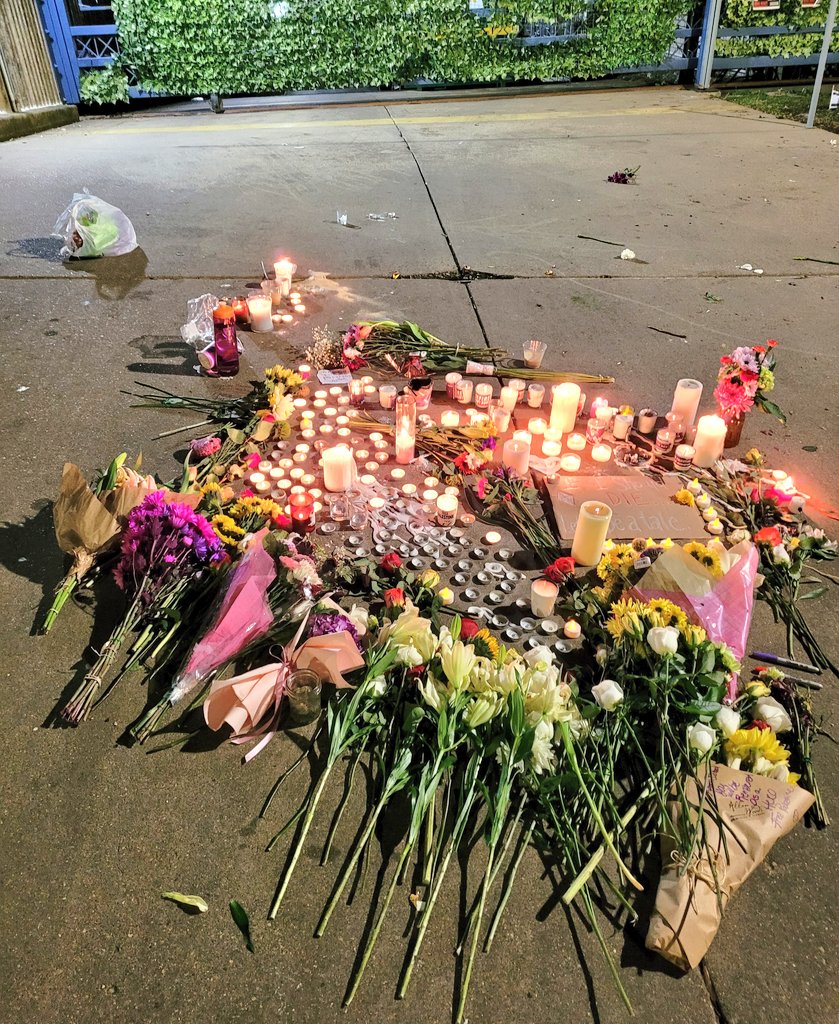 Kahlissee's tweet image. A vigil at Aaron Bushnells final place where he self-immolated.