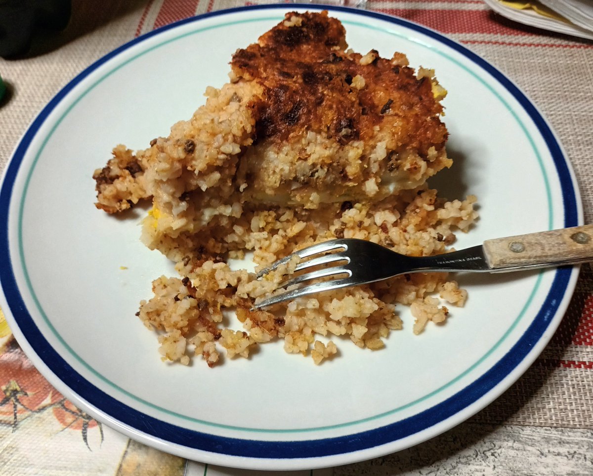 Riso al forno alla calabrese, with Roma rice, tomato sauce, minced meat, hard-boiled eggs, mozzarella, provola and grana padano