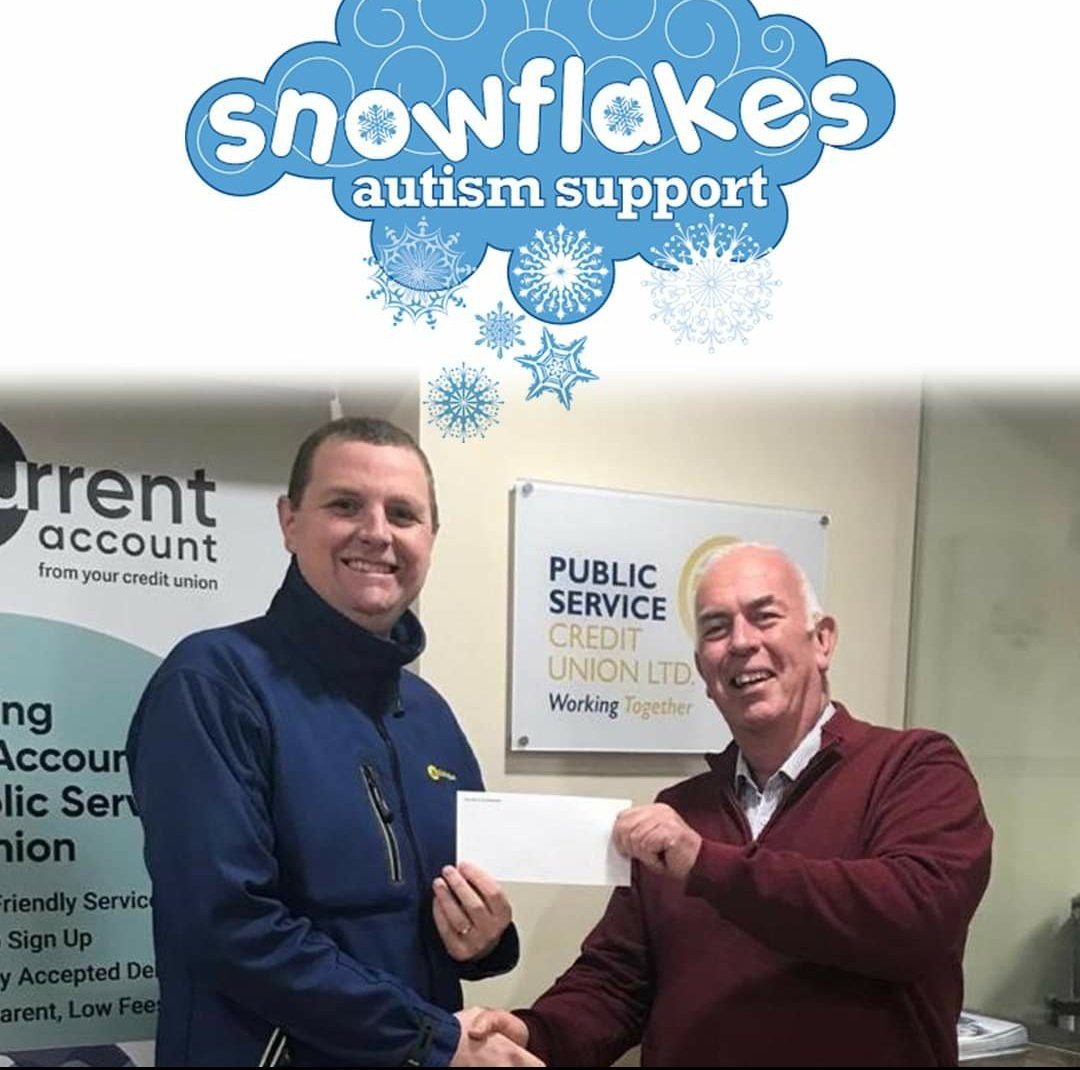 Stephen Bennett from Snowflakes Autism Support being presented with a donation cheque from PSCU in Earl Place today #publicservicecu #creditunion #snowflakes_autism #autism #donations
