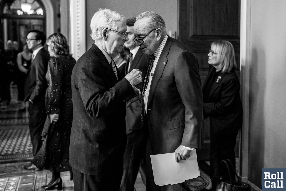 Senate Majority Leader Schumer and Minority Leader McConnell huddle in the Capitol after the weekly Senate luncheons