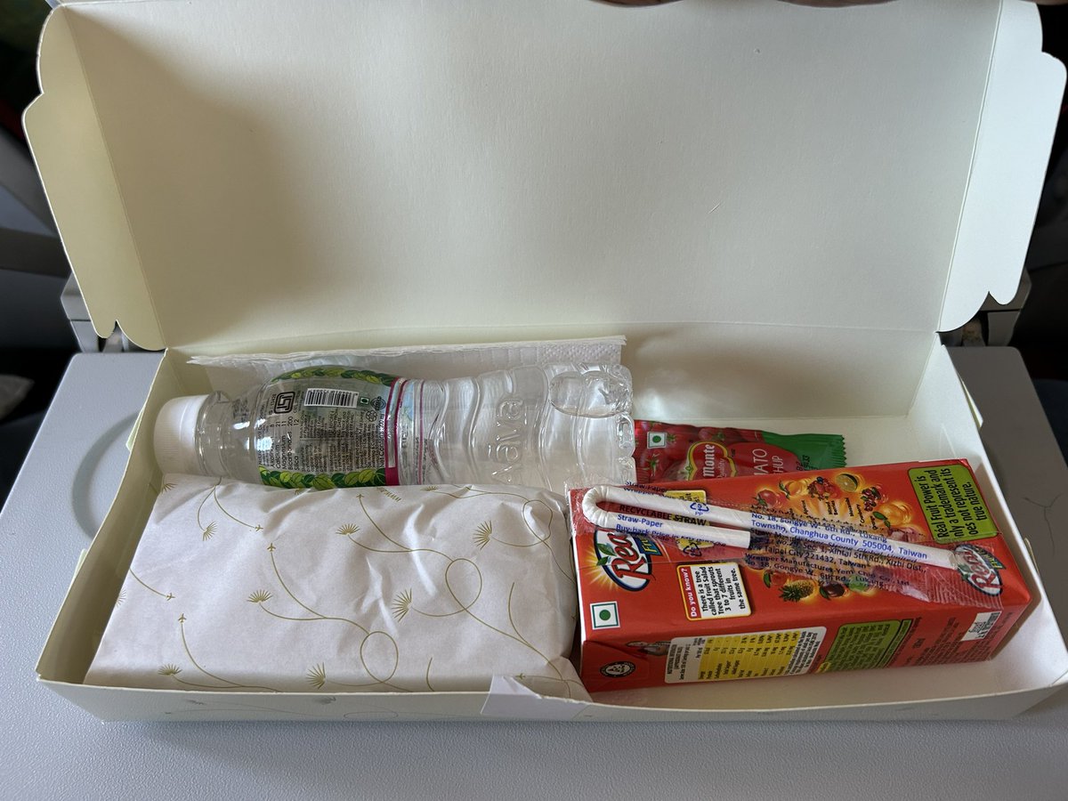 quadgowl's tweet photo. First time served snacks on a 30 minute economy flight. Good going @airindia ! https://t.co/ToUMFwLXML