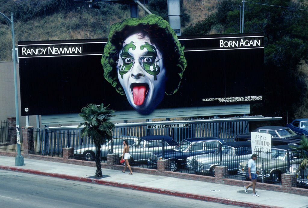 Billboard to promote the release of Randy Newman's 1979 album, 'Born Again' on the Sunset Strip, Hollywood, California