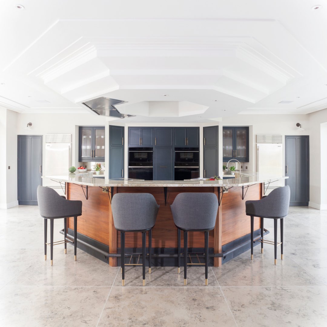 This beautiful kitchen by the team @stephengraver sits at the heart of a very special Somerset property. Including a bespoke ceiling hood angled to the exact shape of the cooking zones below.