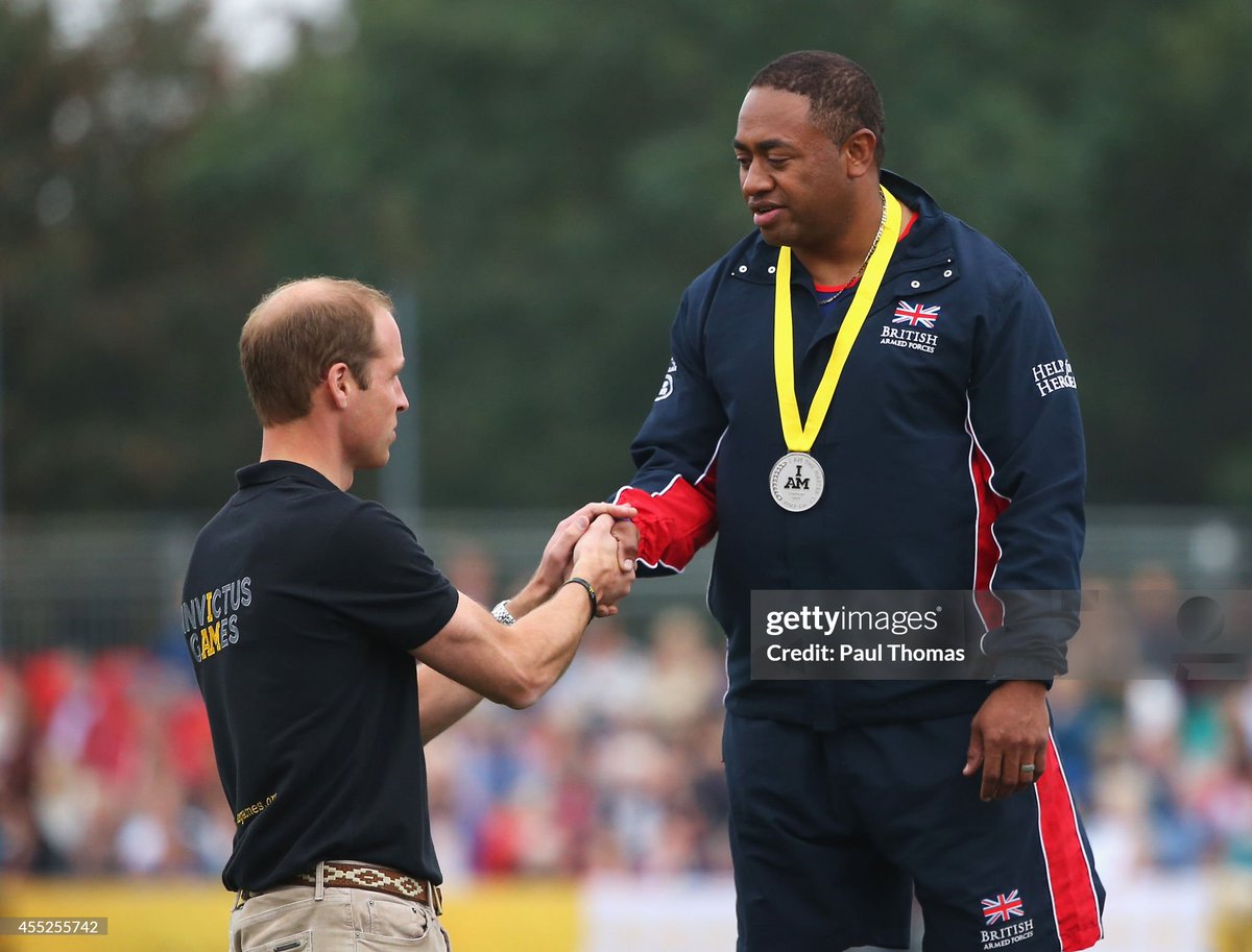 Prince William presents the Invictus Games medal to Silver medalist Derek Derenalagi of Great Britain in 2014. So where is Harry if this was his thing?
#PrinceHarryIsALiar 
#MeghanandHarrygriftVeterans 
#HarryandMeghanRuinedInvictus