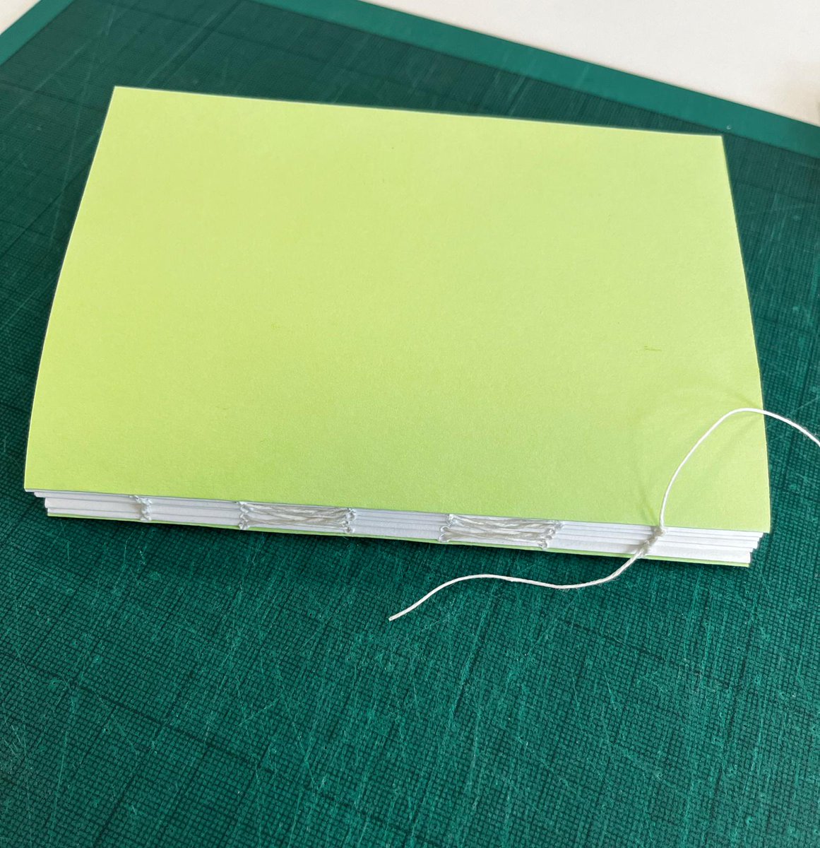 The Pathfoot Press interns had a blast yesterday, learning the fundamentals of book binding under the supervision of the wonderful Marion Archibald from The Old Printing Works. Needless to say we are addicted. And look how shiny! 
Many thanks, @ScotsAntiquary, for organising