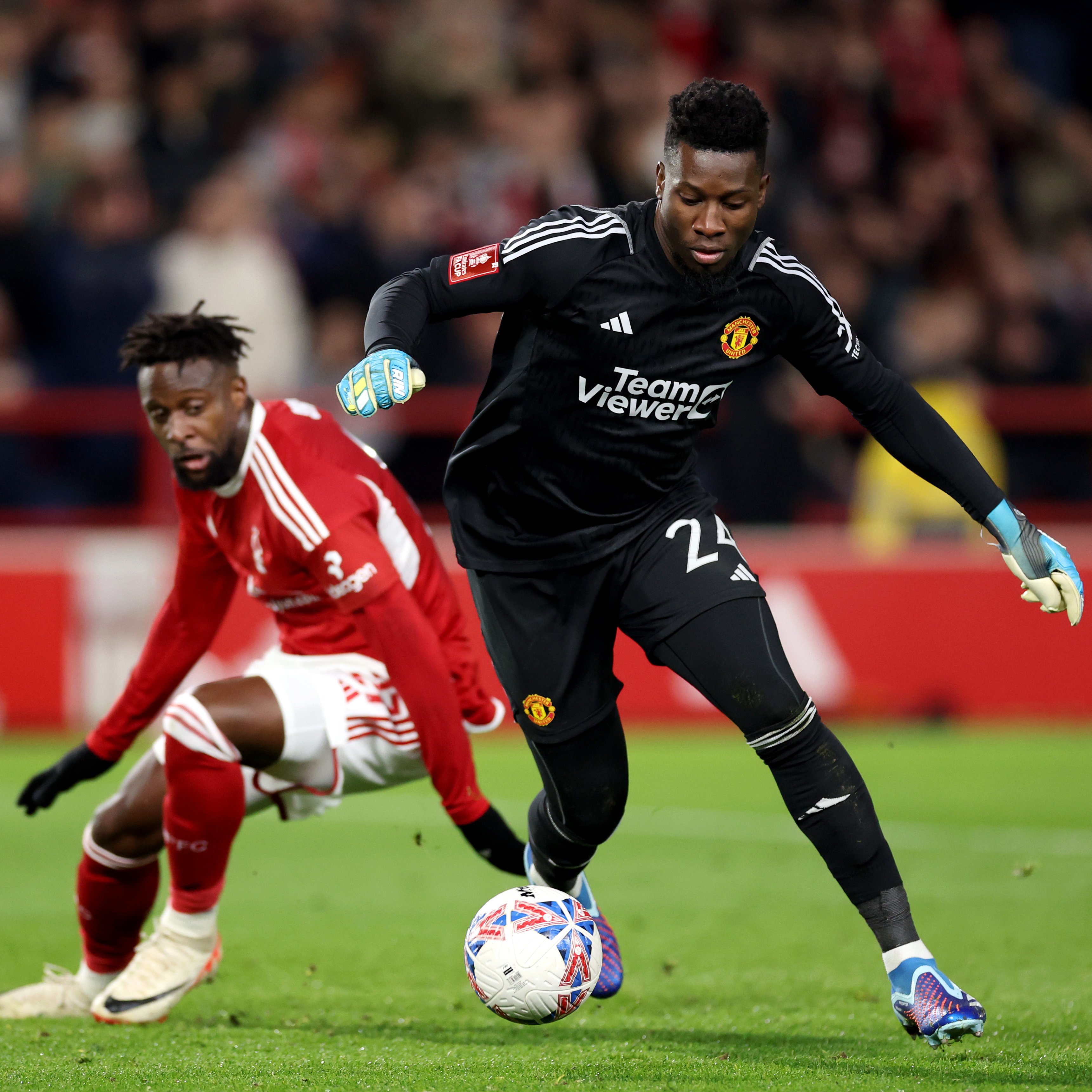 An image of André Onana dribbling with the ball for Manchester United
