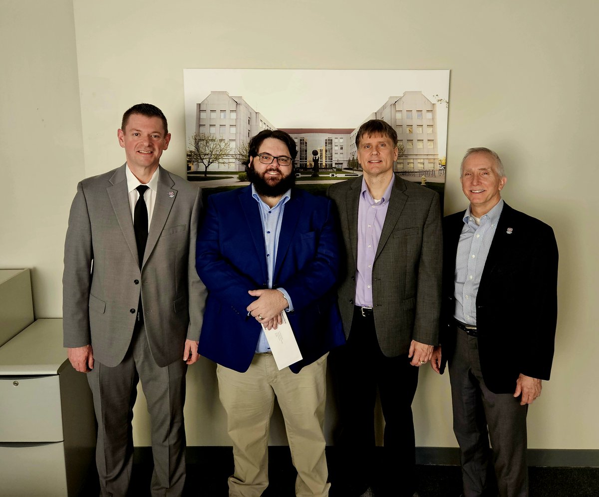 Congratulations to Dr. Bill Sandel for receiving tenure and promotion to associate professor. 
Professor Sandel was pictured at a recognition event with Dean Wahl, Director Garland, and Provost Jasinski.