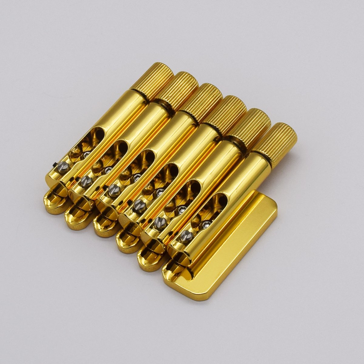 guykeroffi5384's tweet photo. 🌟Introducing our brand new headless guitar bridge in gold, designed to perfectly fit the Strandberg Boden Standard or any guitar with a string spacing of 10.5mm. We're also currently working on producing gold locking nuts to complement this stunning bridge. https://t.co/lxMlsfzgXx