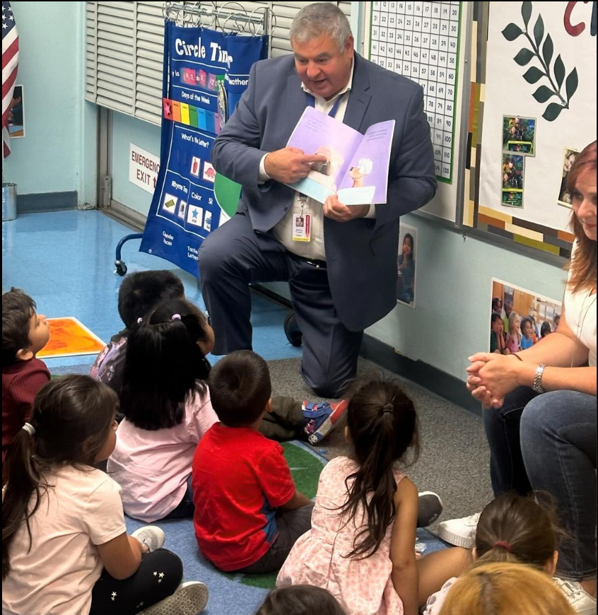 Chief Romero conducting a Read Aloud at Alexandria EEC.