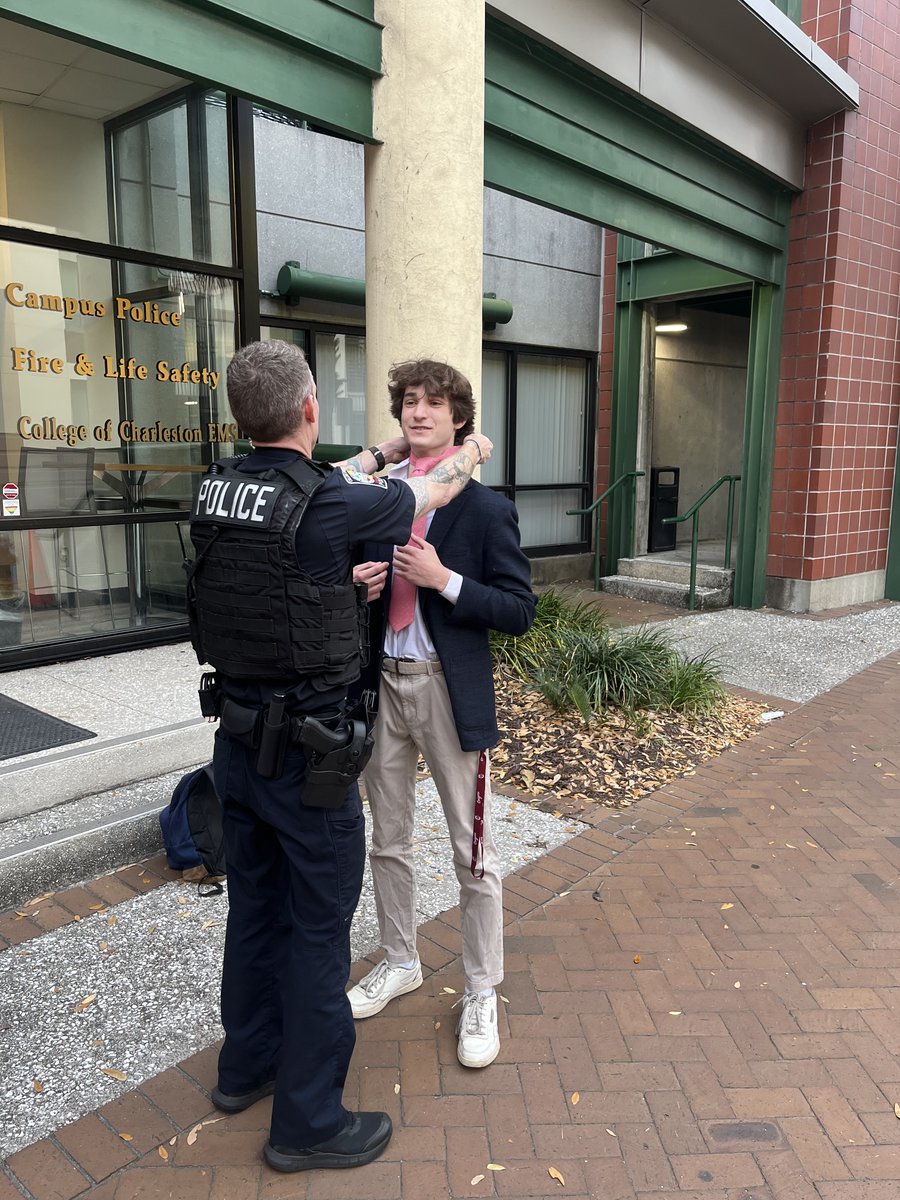CofC_DPS's tweet photo. As a police officer, you never know what your next call may entail. For this specific call, OFC. J. Stamper was able to help a student with his tie! https://t.co/V80VG3oUWs