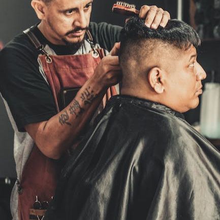 _boxingbarber's tweet photo. Whether you want a classic gentleman's trim, a creative design, or a sharp combat cut  The Boxing Barber can deliver a look that will have you ready to step into the ring of life in style. #boxingbarber #hairstyles #fades #tapercut #boxingculture https://t.co/nkJb6dKtja