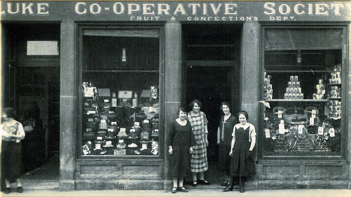 #Coopofthweek. C is for Carluke. Carluke Co-operative Society was established in 1862 and merged with Scotmid 1981 after 119 years. The first dividend was 1s 6d per £1. The ladies pictured here were at the Fruit and Confections department.
