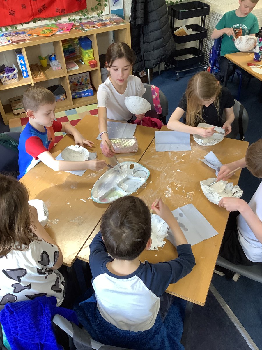 We got extremely messy using paste and strips of paper to create a paper mache bowl. We learned about the process and after popping our balloons we reassessed what we could do differently next time, mainly more layers! Here we are beginning to paint them ready for decoration.