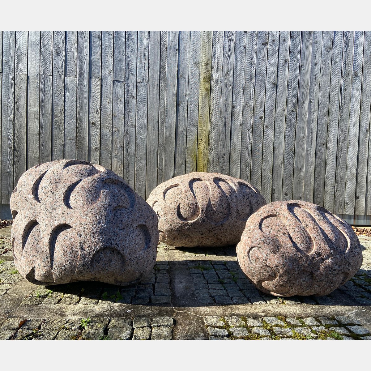 Embrace Triptych: formerly a single carved stone, now a three-part work, almost 4 tonnes of pink Finnish granite. #peterrandallpage #contemporarysculpture #granite #newwork #recentwork #sculpture #stonecarving