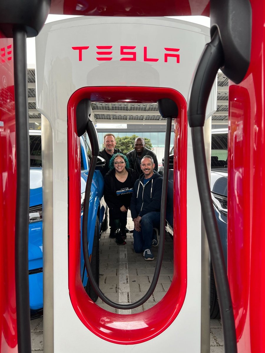 Just a bunch of <a href="/Ford/">Ford Motor Company</a> Mach-E owners happily charging at a Supercharger with our official NACS adapter! We're so excited to have more charging options for our #MustangMachE &amp; all Ford EVs!