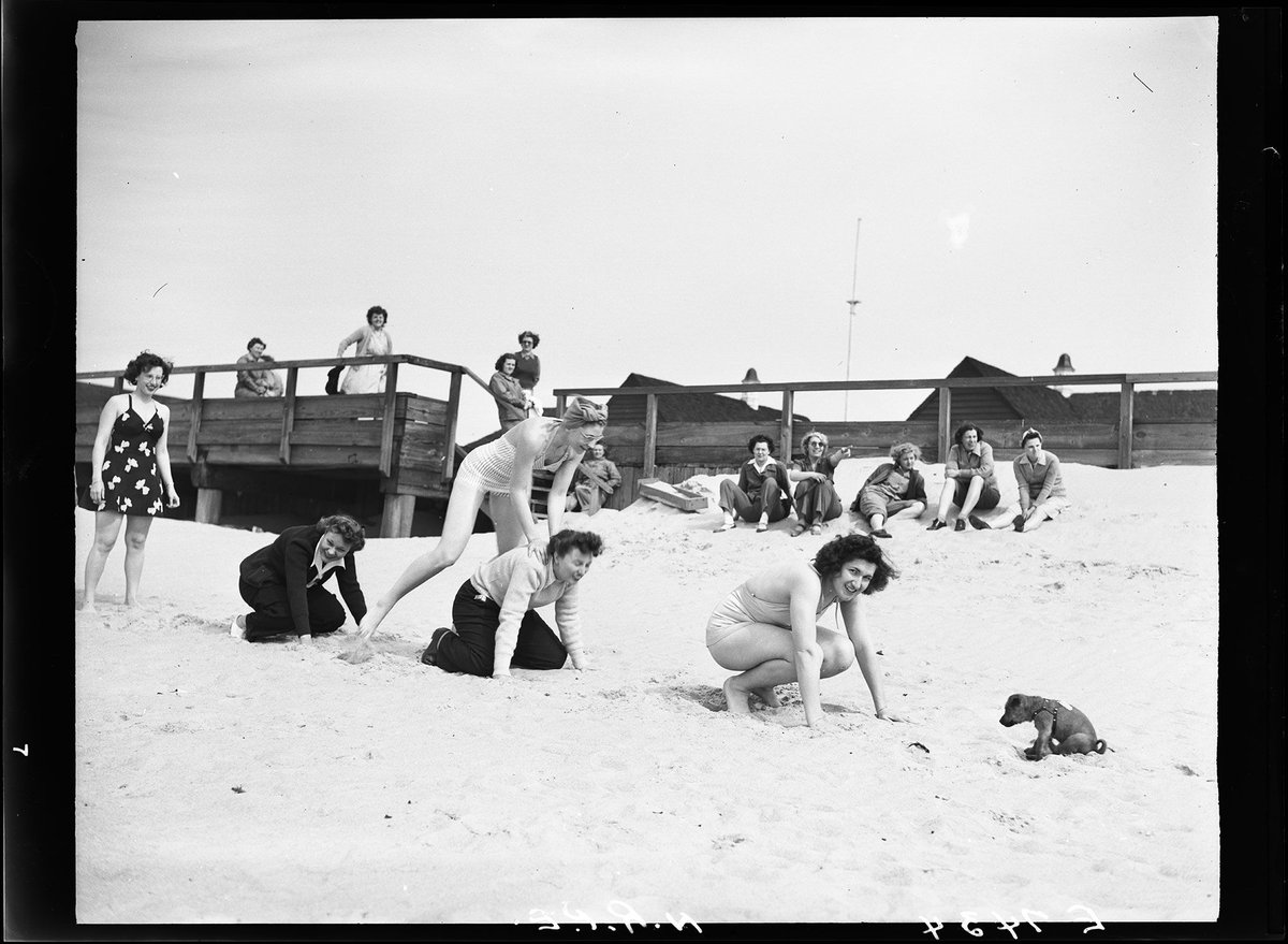 Happy Leap Day! Or should we say… Hoppy Leap Day? 🐸🎉 Ever played leapfrog with a dog? We haven’t, but it sure looks entertaining! Check out this fun photo depicting four members of the Women’s Army Corps playing leapfrog on the beach at Fort Story, Virginia.