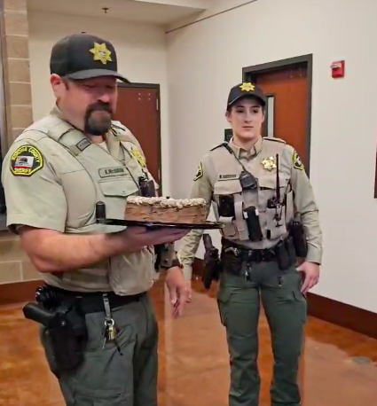 After court support we marched over to the sheriff's office to, once again, ask them to prosecute criminal animal cruelty at Reichardt and Petaluma Poultry. This time we tried something new, we baked them a cake! 
To our surprise the police accepted our gift!
And not to our