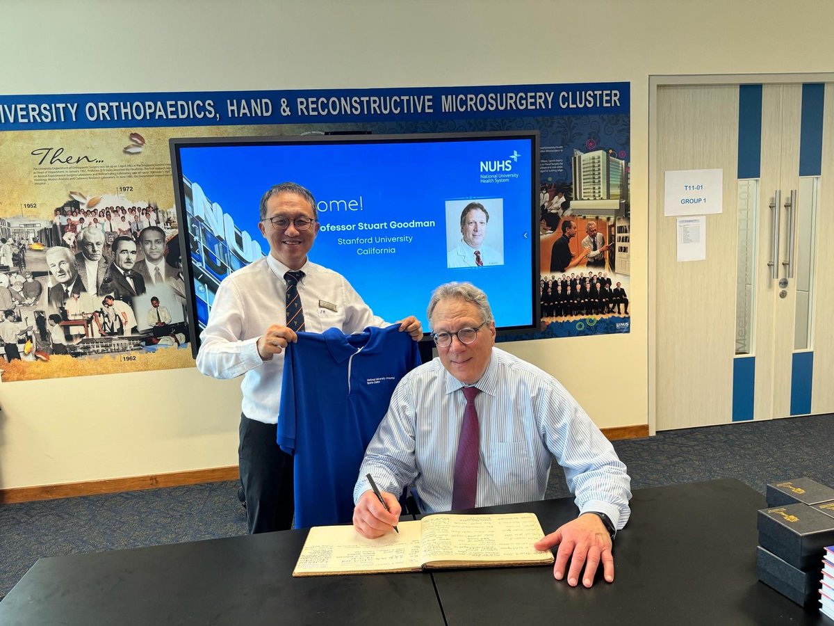 Dr. Goodman recently presented in Singapore as a special guest! Seen here signing the guest book as a special visitor to the Department of Orthopaedic Surgery of the National University of Singapore, and being given the book that outlines the history of the NUS Department.