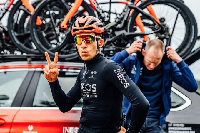 Michal Kwiatkowski makes the peace sign as he looks directly at the camera. 