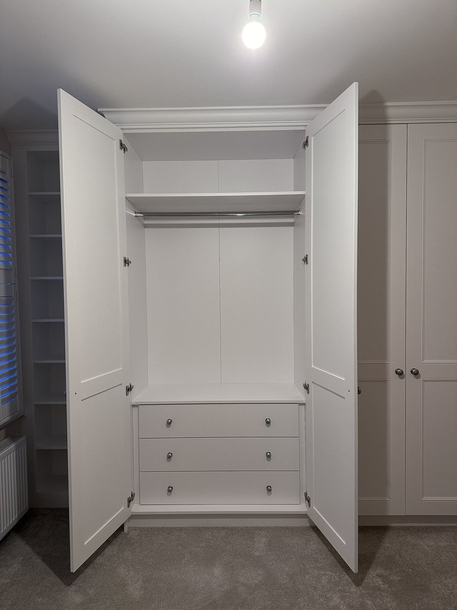 Finished this little project in Twickenham yesterday. Traditional double wardrobes with a set-back bookcase. On the other side of the room a traditional alcove cupboard and floating shelves. All hand painted in Loft White by Little Greene.
