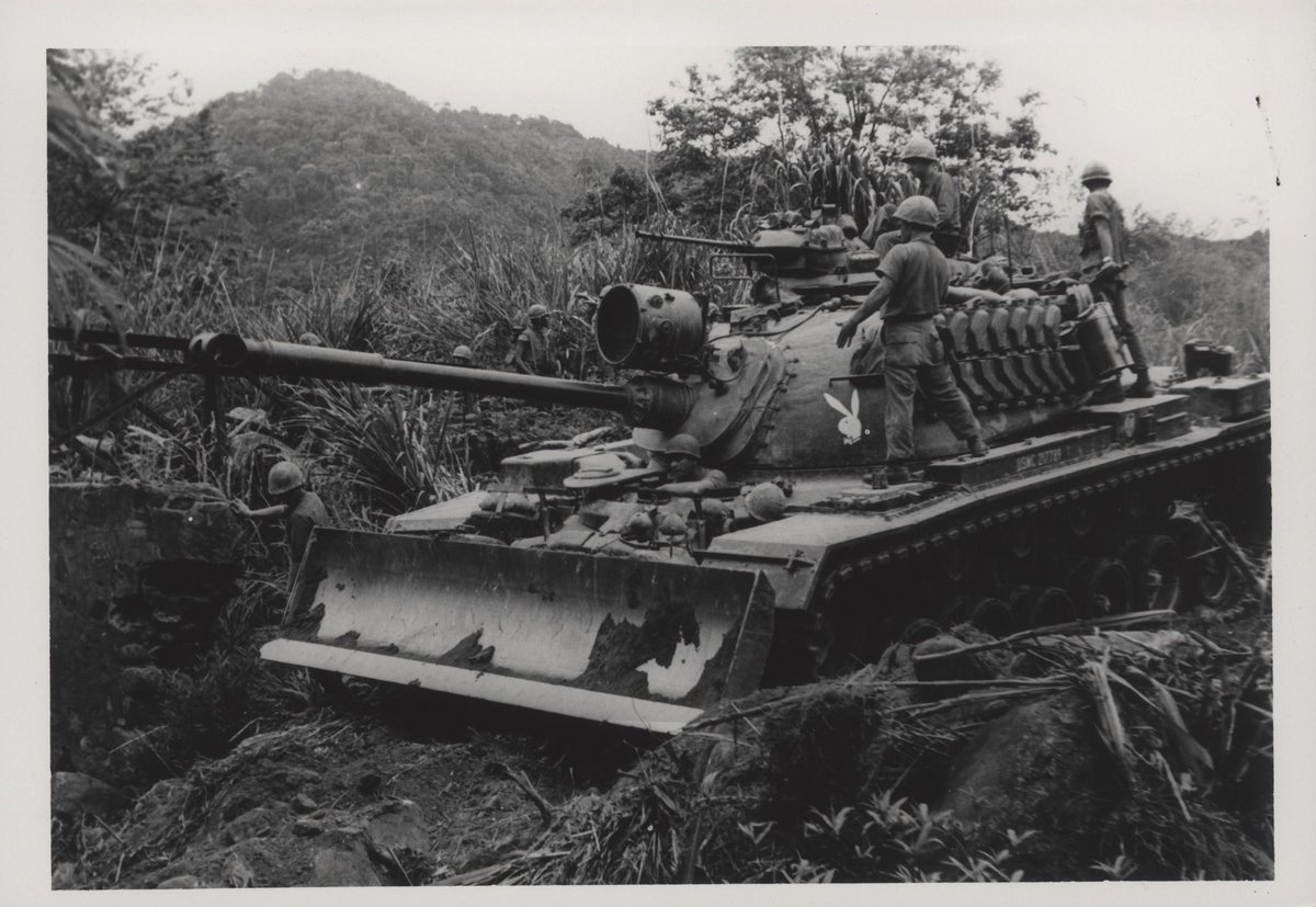 #ThisDayInHistory This photograph is from March 6th 1967. The photograph is captioned “Tankers Construct Road: A blade wielding tank of the 1st Tank Battalion carves a road for the Leathernecks of the 2d Battalion, 26th marines (2/26) during an operation south of Sa Nang.