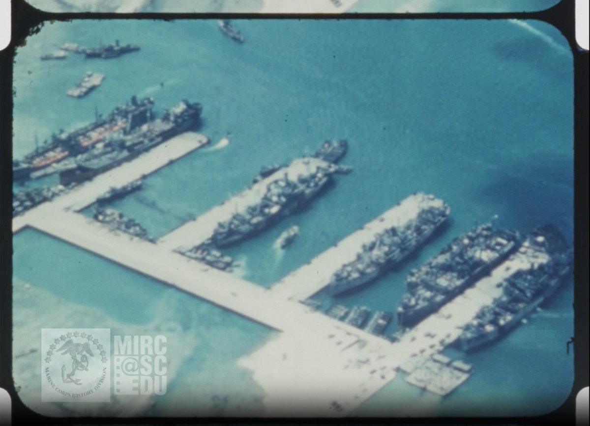 #OnThisDayInHistory #FromOurCollections Aerial views of Saipan harbor. Troops and supplies loaded onto USS Bayfield (APA-33). Troops exercise on deck of ship as convoy leaves Saipan for Okinawa for Operation Iceberg. Marines in combat gear load onto LCMs.