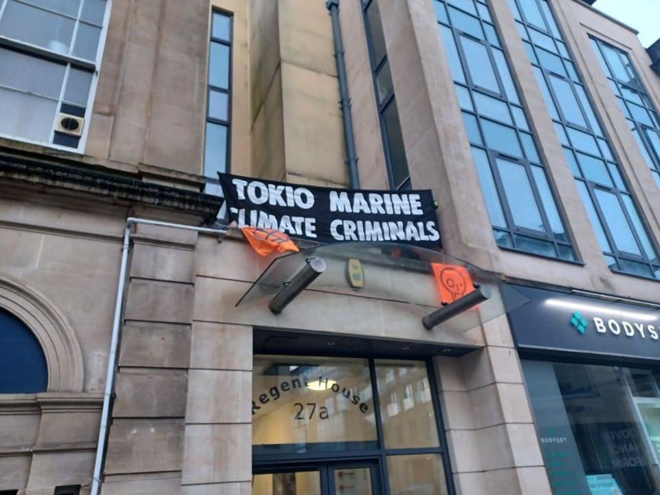 JSO & XR occupy rooftop of Tokio Marine in Bristol, as part of the #InsureOurFuture week of action. On top of the projects the company already insures, it’s been identified as a potential insurer for the 'carbon bomb' #EACOP project in Africa. Join us at 27a Regent Street, BS8
