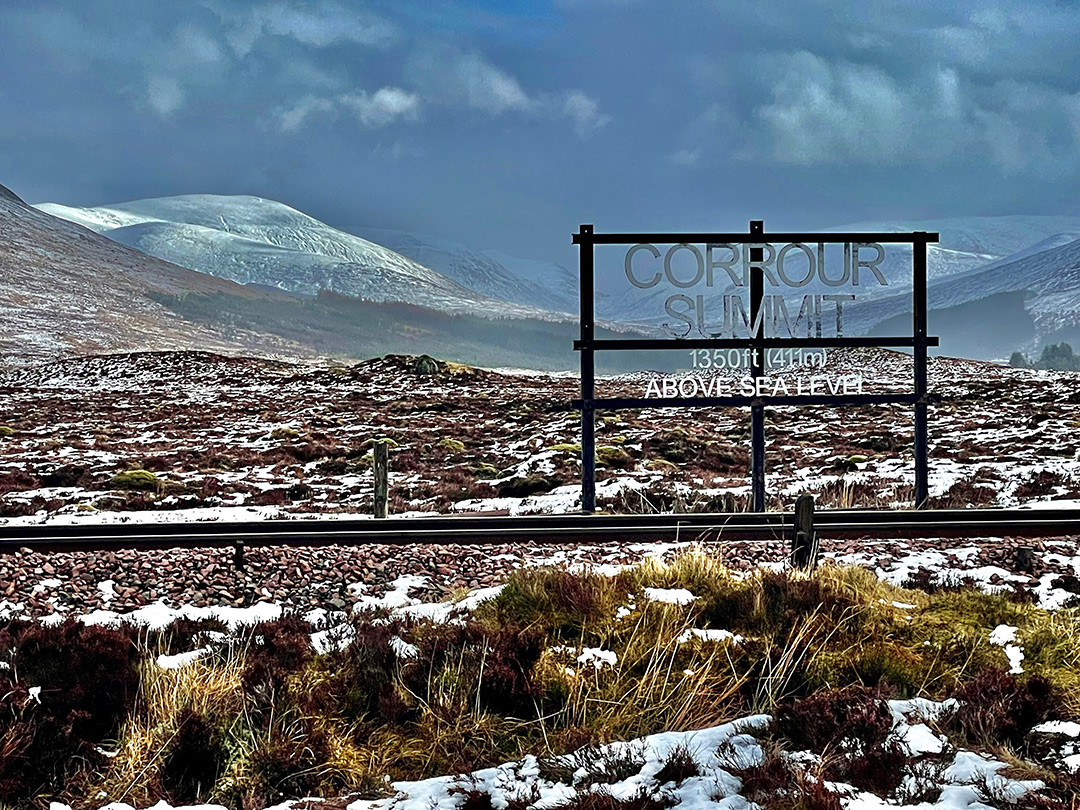 Corrour Summit sign stating that it is 1350ft above sea level.