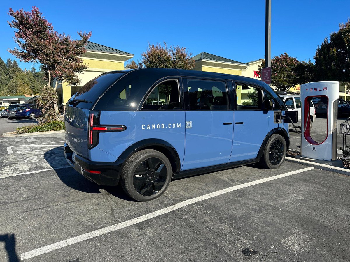 Cool to see a Canoo charging at a Supercharger using a Magic Dock. 📷: plugshare.com/location/230745