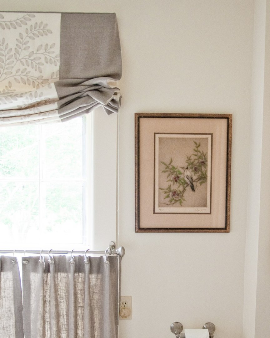 Custom window treatments are one way to add a timeless design detail that elevates your home. This custom valance paired with cafe curtains in this bathroom adds a touch of privacy without losing all the natural light - a win-win in my book! photographer: @johnwhession