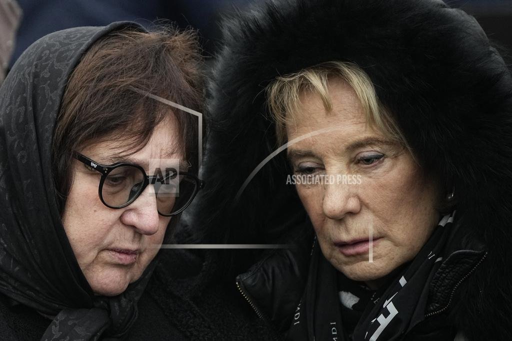 The mother of Alexei Navalny and the mother of Yulia Navalnaya at the graveside AP Photo