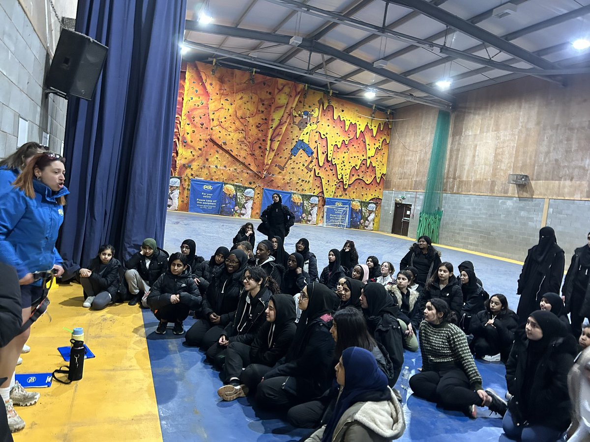 The pupils are listening studiously as they learn how to wear a harness at PGL.