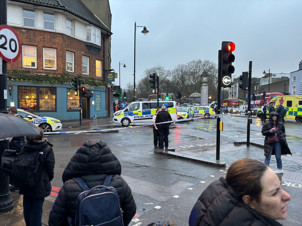 I found myself in what appeared to be a shooting incident at Clapham Common a bit earlier. Loads of police cars, a helicopter, ambulances. Is that a bullet hole in the first photo? Roads all blocked and cordoned off. #Claphamcommon