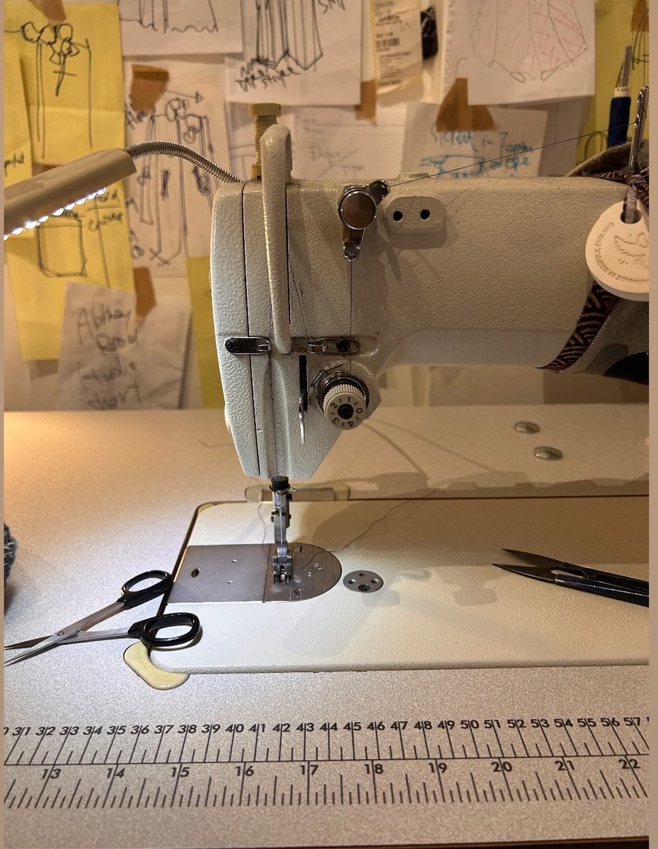 I love this photo behind the sewing machine are the many layers of drawings, ideas I have