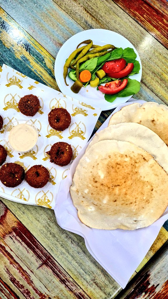 #lunch anyone ?
Freshly bakes bread ,falafel,  hummus and salad .  #lebaneseFood