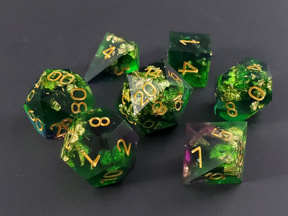 GeekMeUp_Scotty's tweet photo. Necromantic Hoard, a dice set of black, green, gold flake, and hints of purple. 

#dnd #dungeonsanddragons #dice #dicemaker #diceaddict #dicegoblin #ttrpg https://t.co/hJ2tTeUneR