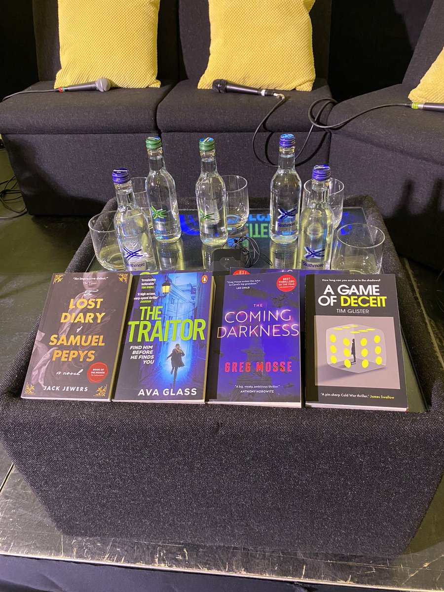 The stage is set! Writing Spies in the Shadow of Bond 🔍 Panel hosted by @frankieisswell of the @readburiedpod with @AvaGlassBooks @jackjewers @GregMosse @timglisterbooks Kindly sponsored by @moonflowerbooks ⭐️ Providing a Moonflower Martini for all guests 🍸 #farnhamlitfest